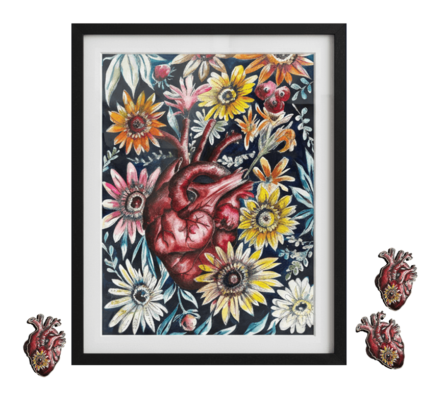 Claire's Art from the Heart print in a black frame — her anatomical heart artwork surrounded by flowers — with three heart pins beside it