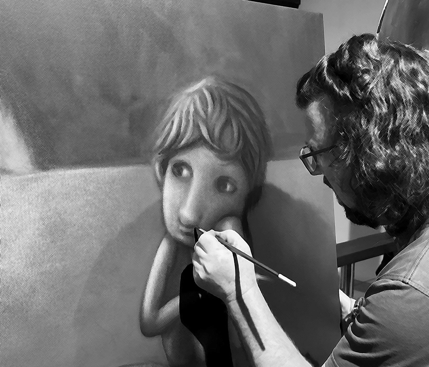 Black and white photo of Glenn at work, painting a large pop surreal portrait on canvas